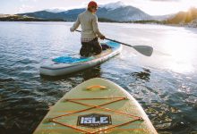 people on Isle inflatable paddle boards